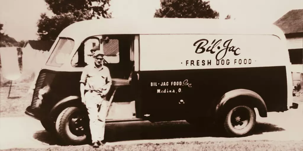 Bill Kelly standing with the original Bil-Jac truck.